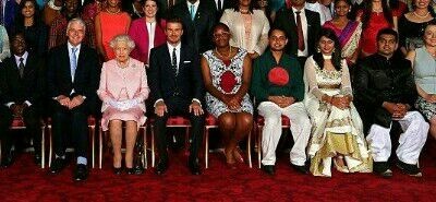 Devika seated next to the Queen, John Major and the Legend David Beckham at the Buckingham Palace, London